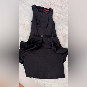 Structured business dress with a flowing details and buckled belt